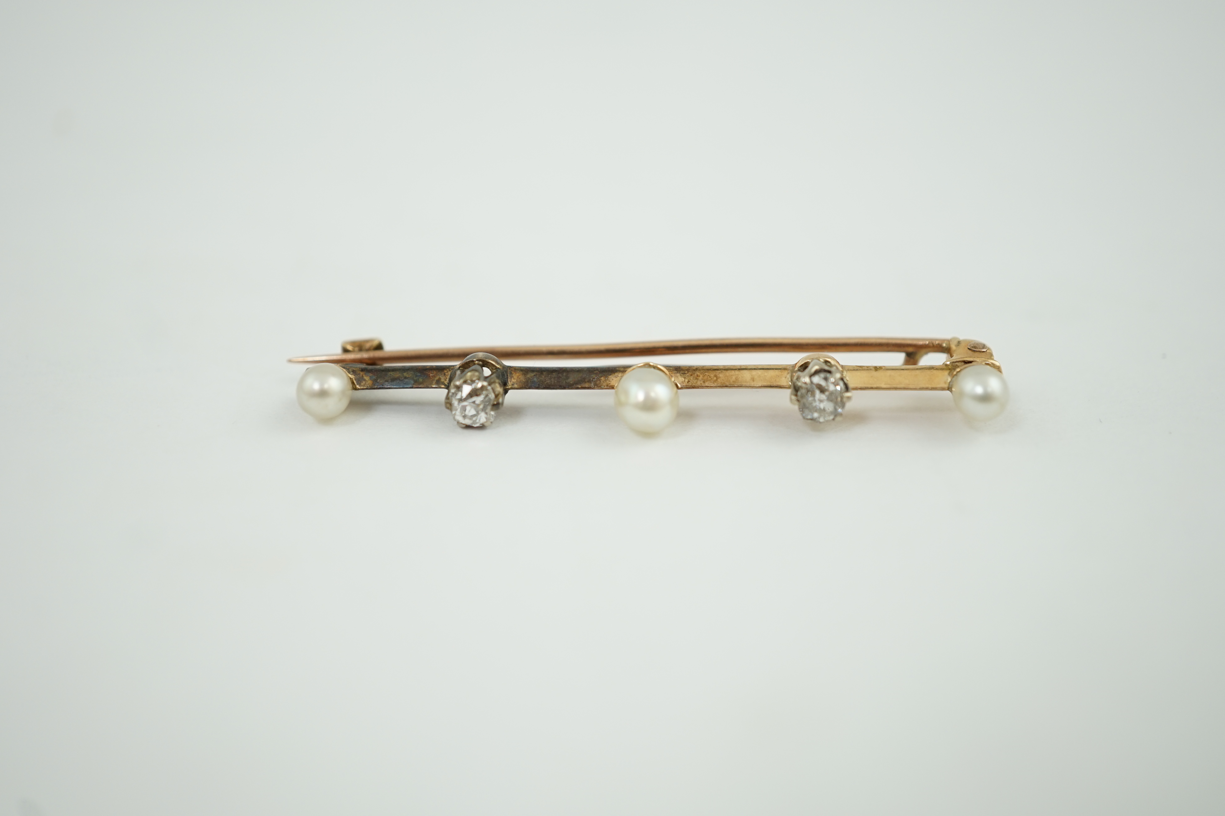 An Edwardian gold, pearl and diamond bar brooch